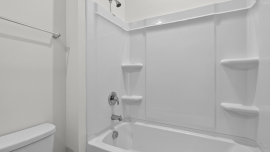 bathroom with tub shower combo
