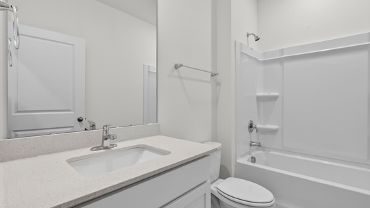 bathroom with tub shower combo