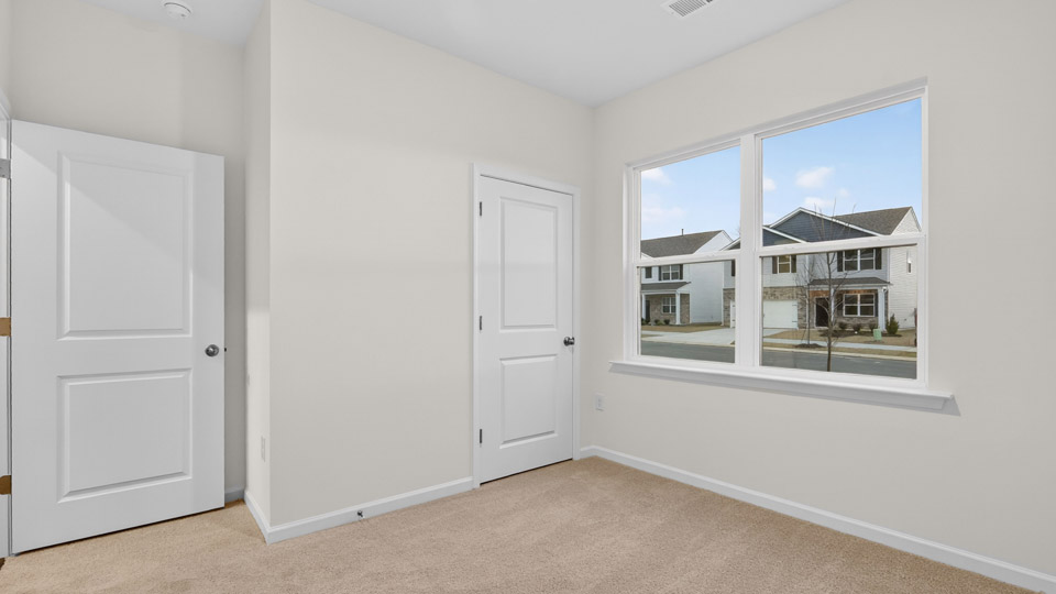 Bedroom with carpet floor and closet
