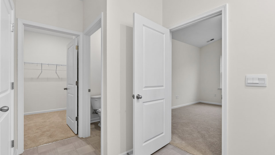 Primary bathroom with double sink and walk-in shower