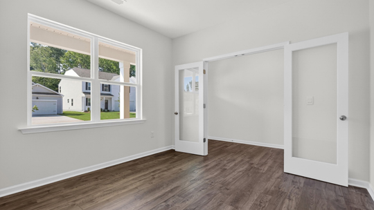 study with french doors and revwood flooring
