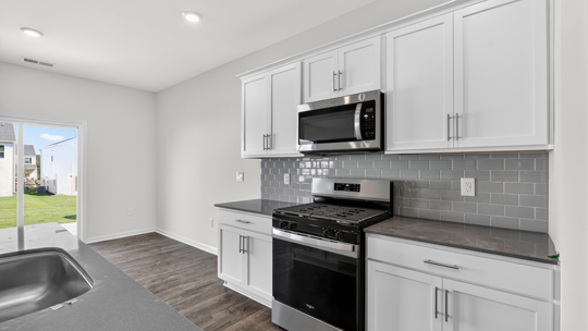 kitchen with quartz countertops white cabinets
