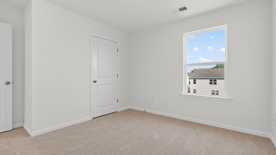 loft with carpet flooring