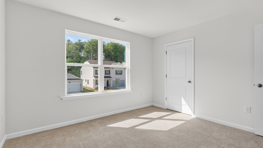 loft with carpet flooring