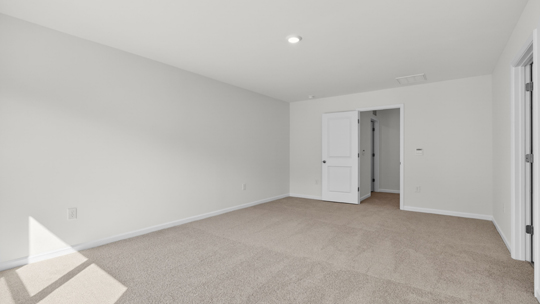 primary bedroom with carpet flooring