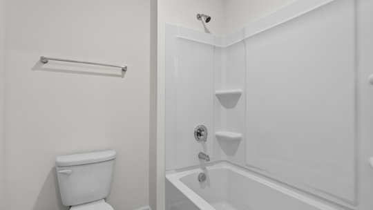 bathroom with tub shower combo