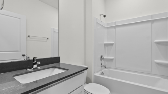 bathroom with tub shower combo