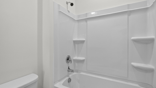 bathroom with tub shower combo