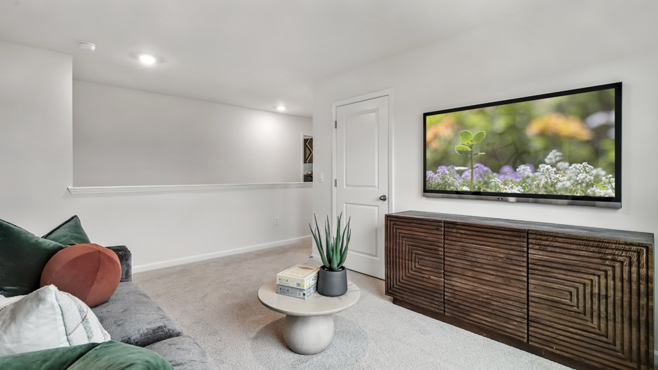 loft with carpet flooring