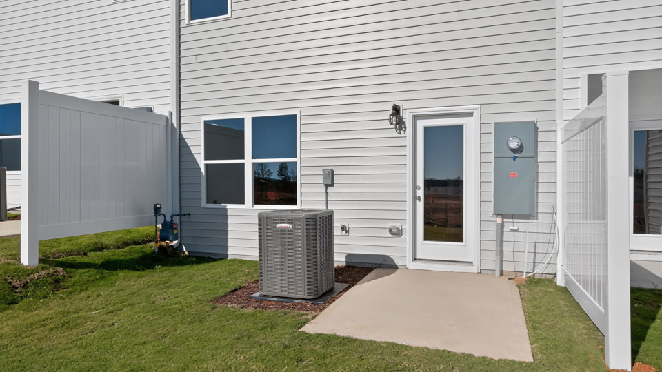 backyard with concrete patio and privacy fences