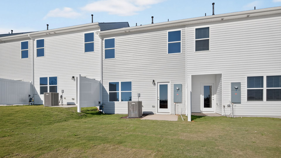 backyard with concrete patio and privacy fences