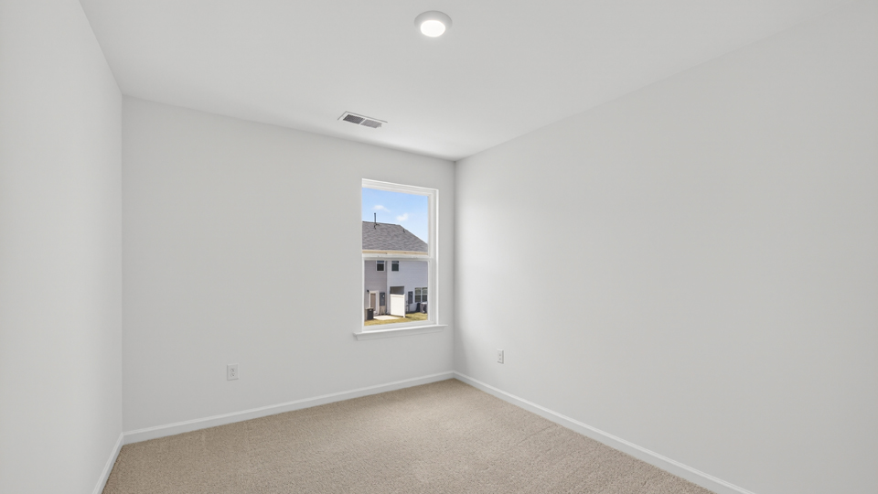 additional bedroom with window, carpeting, closet