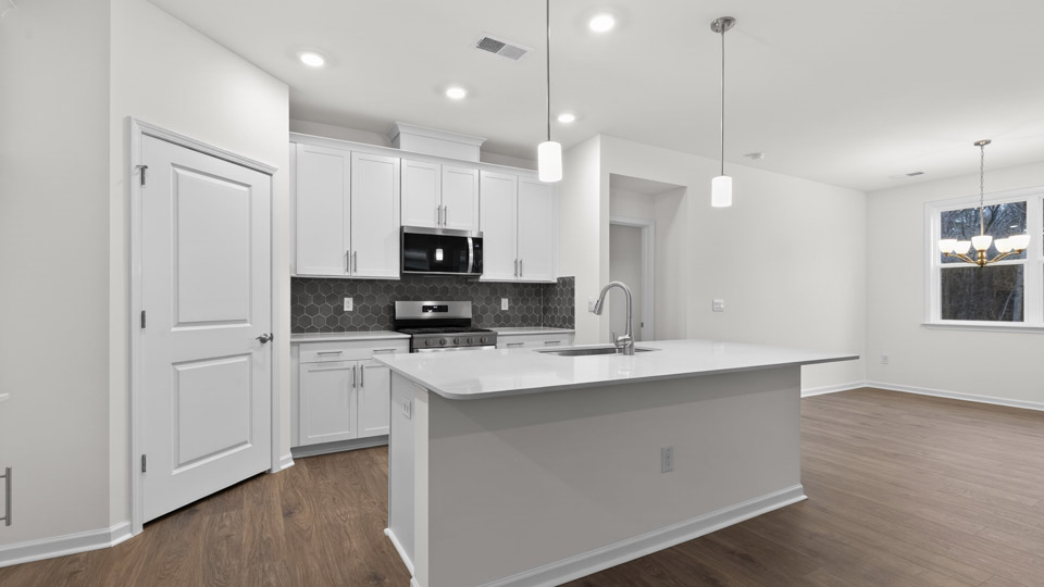 Kitchen with white cabinets and stainless steel appliances.