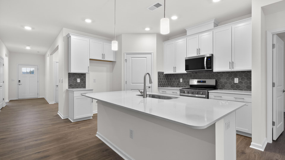 Kitchen with white cabinets and stainless steel appliances.