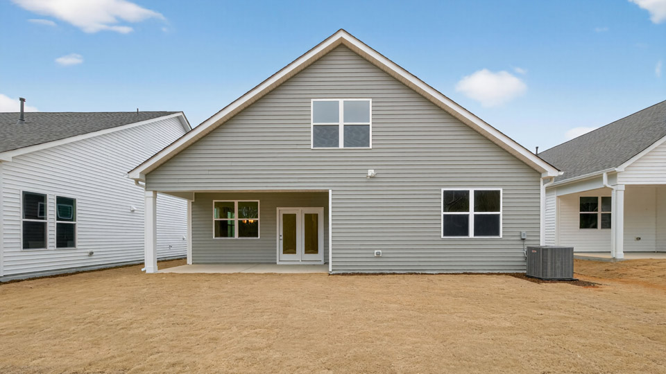 Two story home with gray colored siding