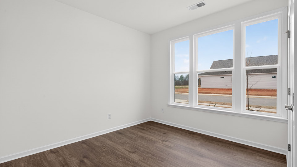 Study room with hardwood floors and big windows