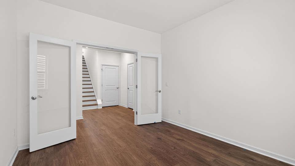Study room with hardwood floors and big windows