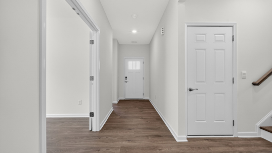 foyer entryway with revwood flooring