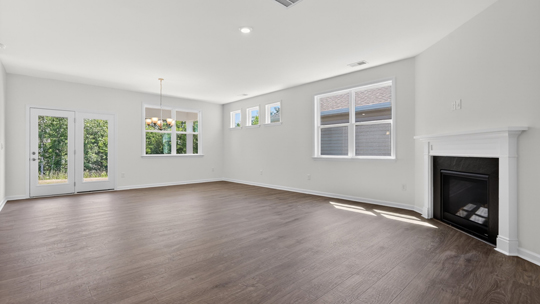 living room with lots of natural light and fireplace