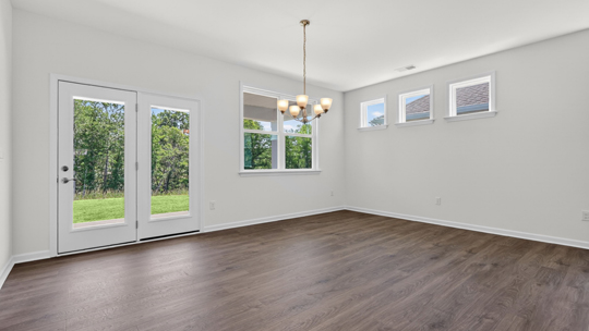 living room and dining area with sliding glass doors