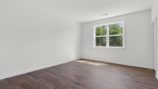 bedroom with revwood flooring