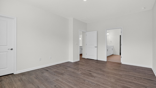 bedroom with revwood flooring