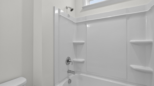 bathroom with tub shower combo