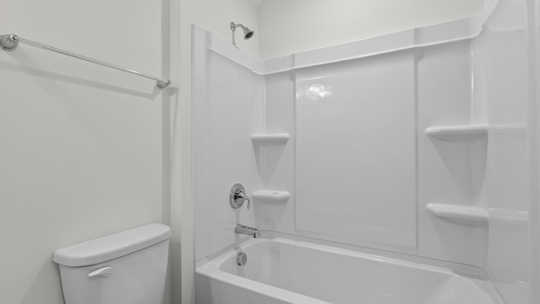 bathroom with tub shower combo