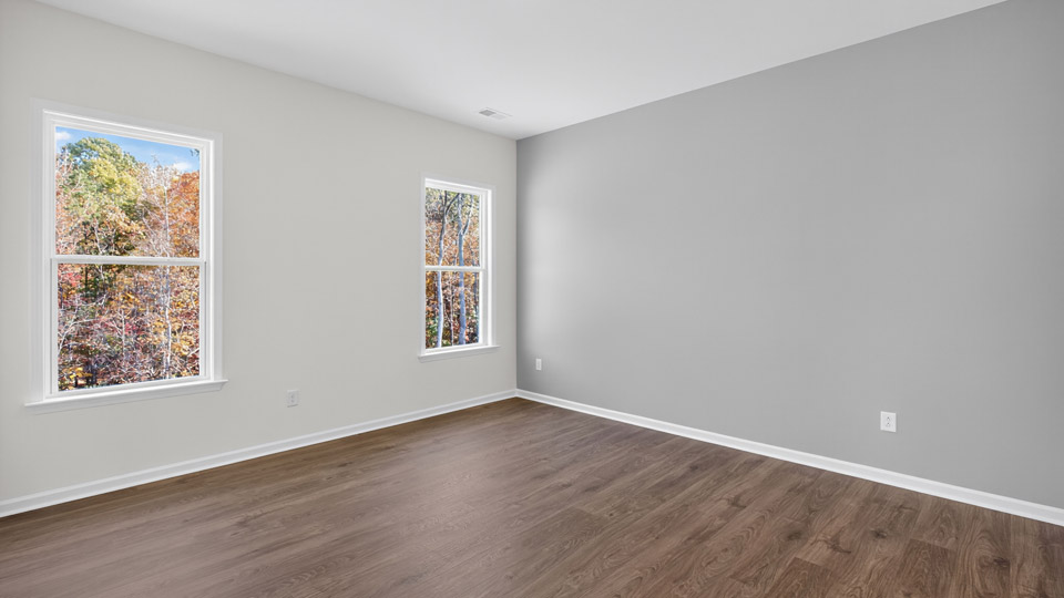 Primary bedroom with revwood flooring