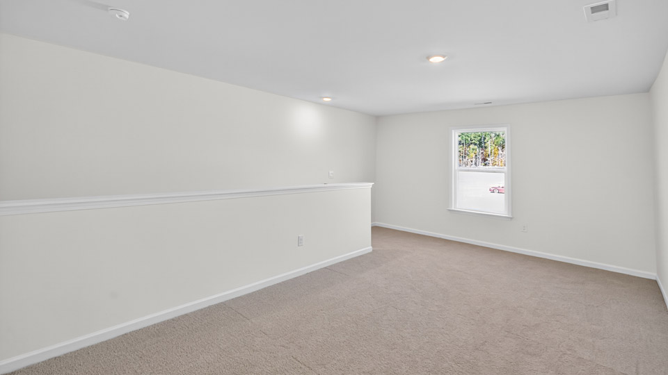 Loft with carpet flooring