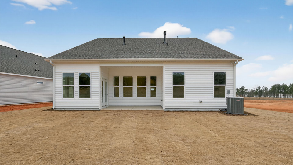 Two story home with white colored siding