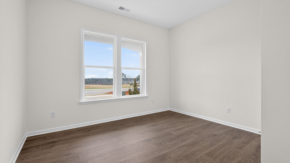 Bedroom with hardwood floor and closet