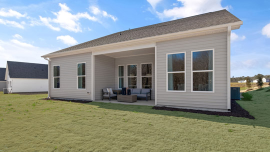spacious backyard with covered patio