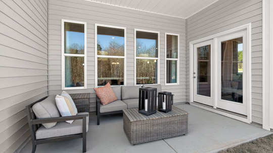 covered patio with sliding glass doors