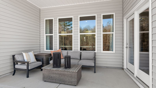 covered patio with sliding glass doors