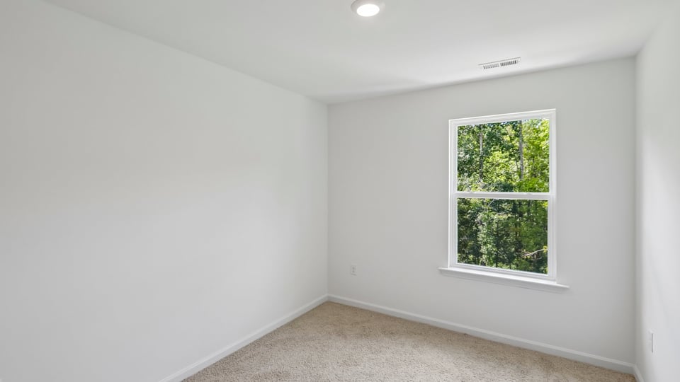 bedroom wtih carpet flooring