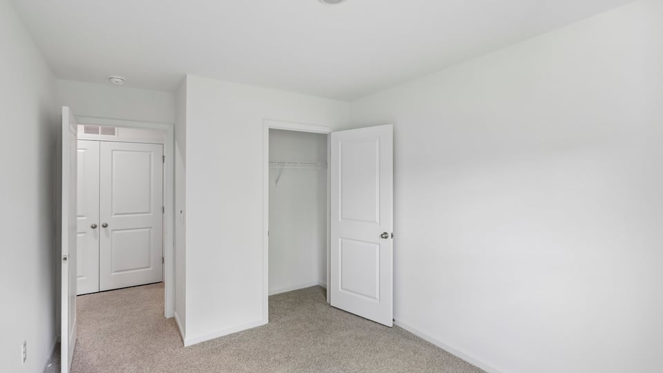 bedroom wtih carpet flooring