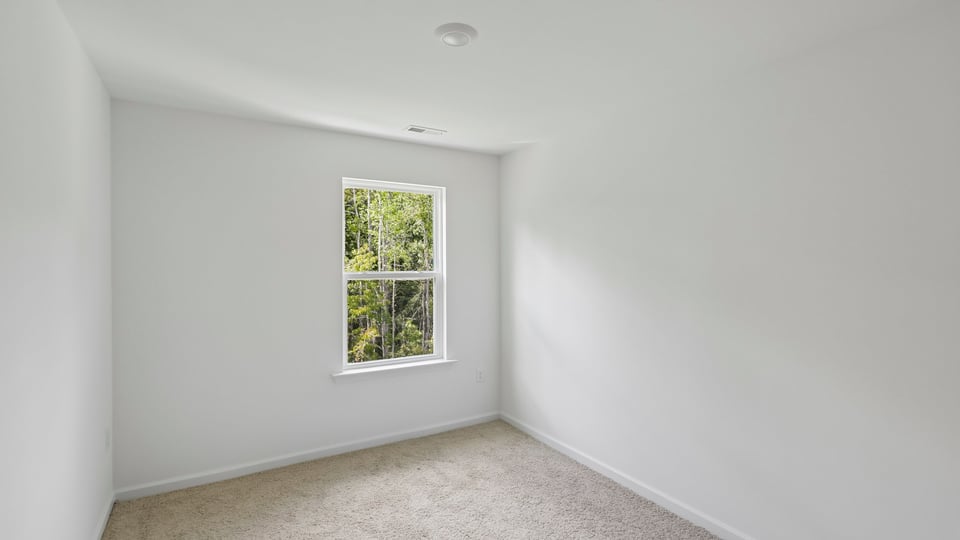 bedroom wtih carpet flooring