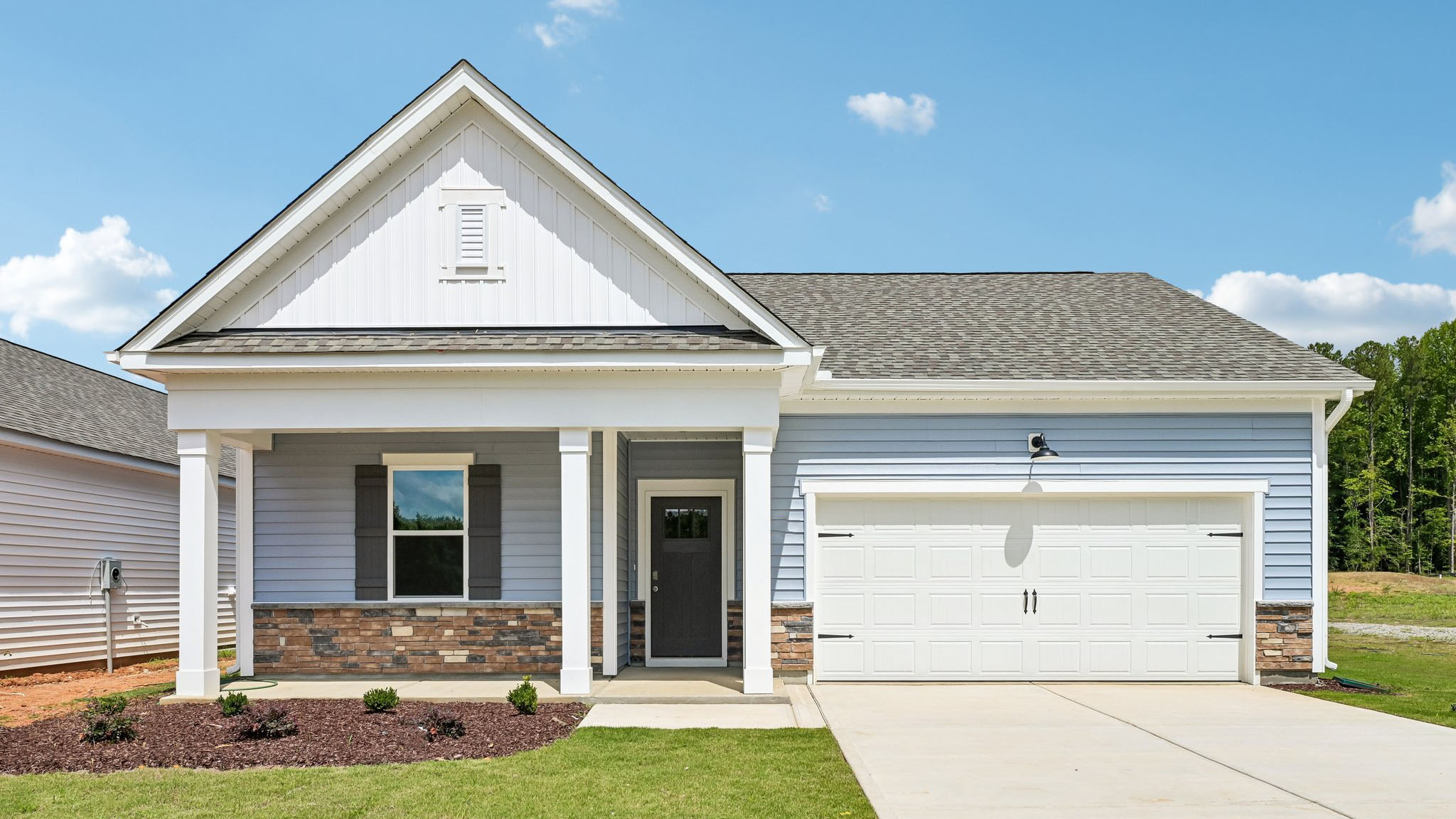 cali Q front exterior with 2 car garage