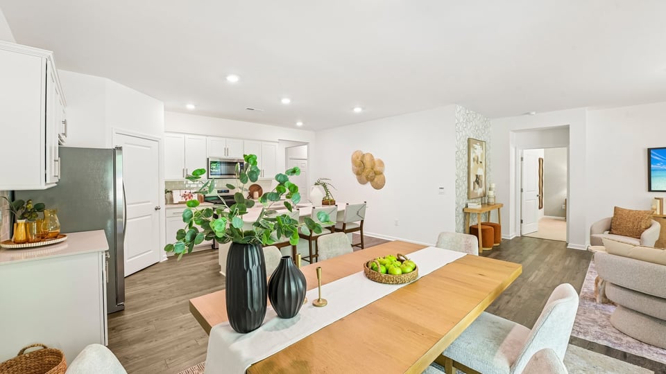 open concept dining space with door to patio