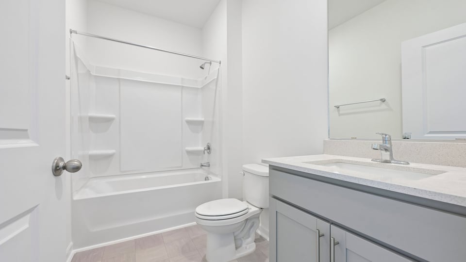 secondary bathroom with tub shower combo