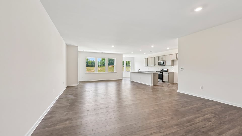 open concept living room opening to kitchen
