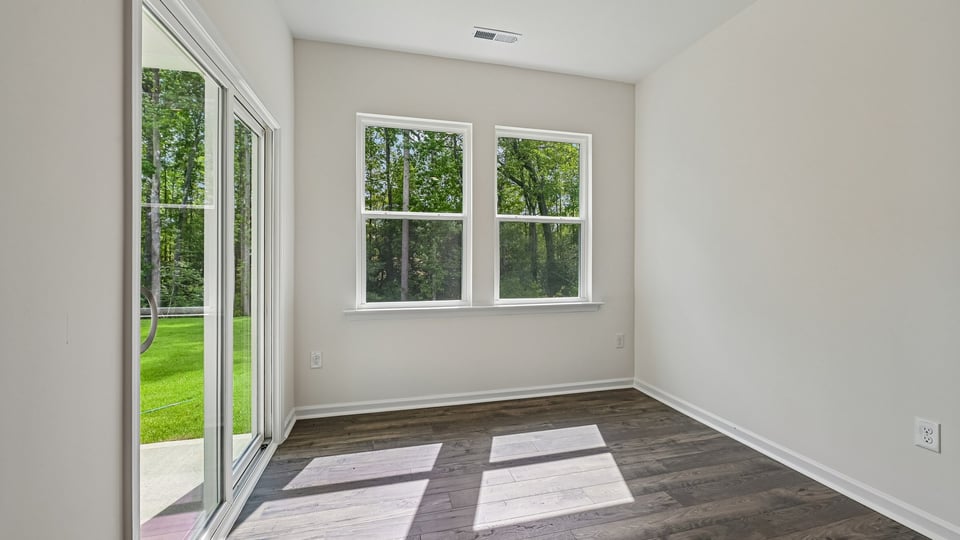 open concept dining space with door to patio