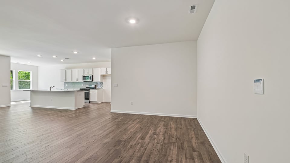 open concept living space with large windows