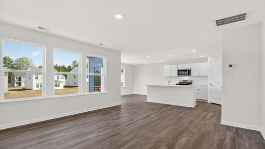 open concept living space with large windows