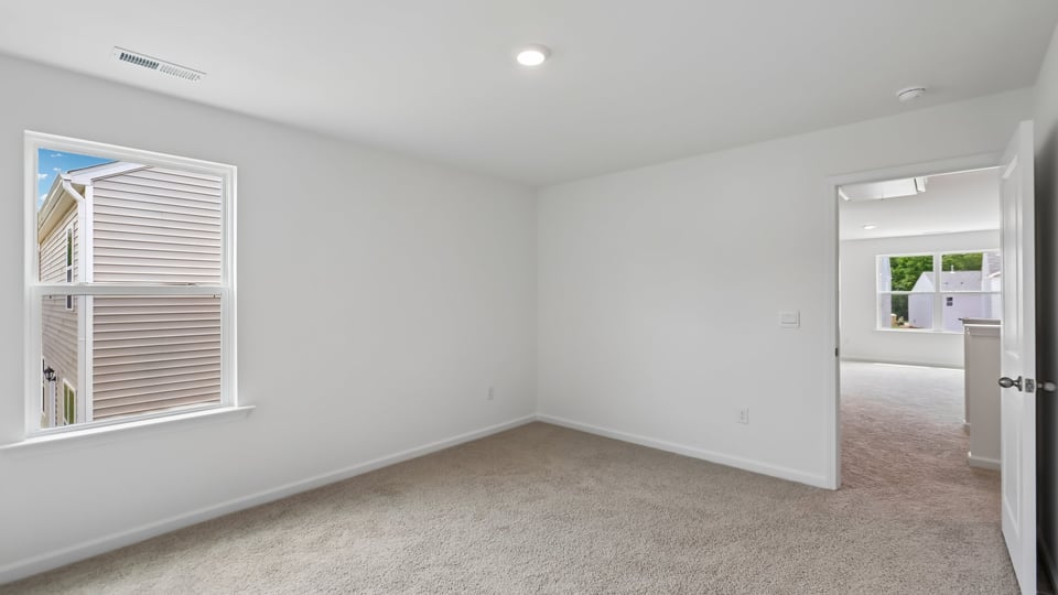 additional bedroom with window, carpeting, closet