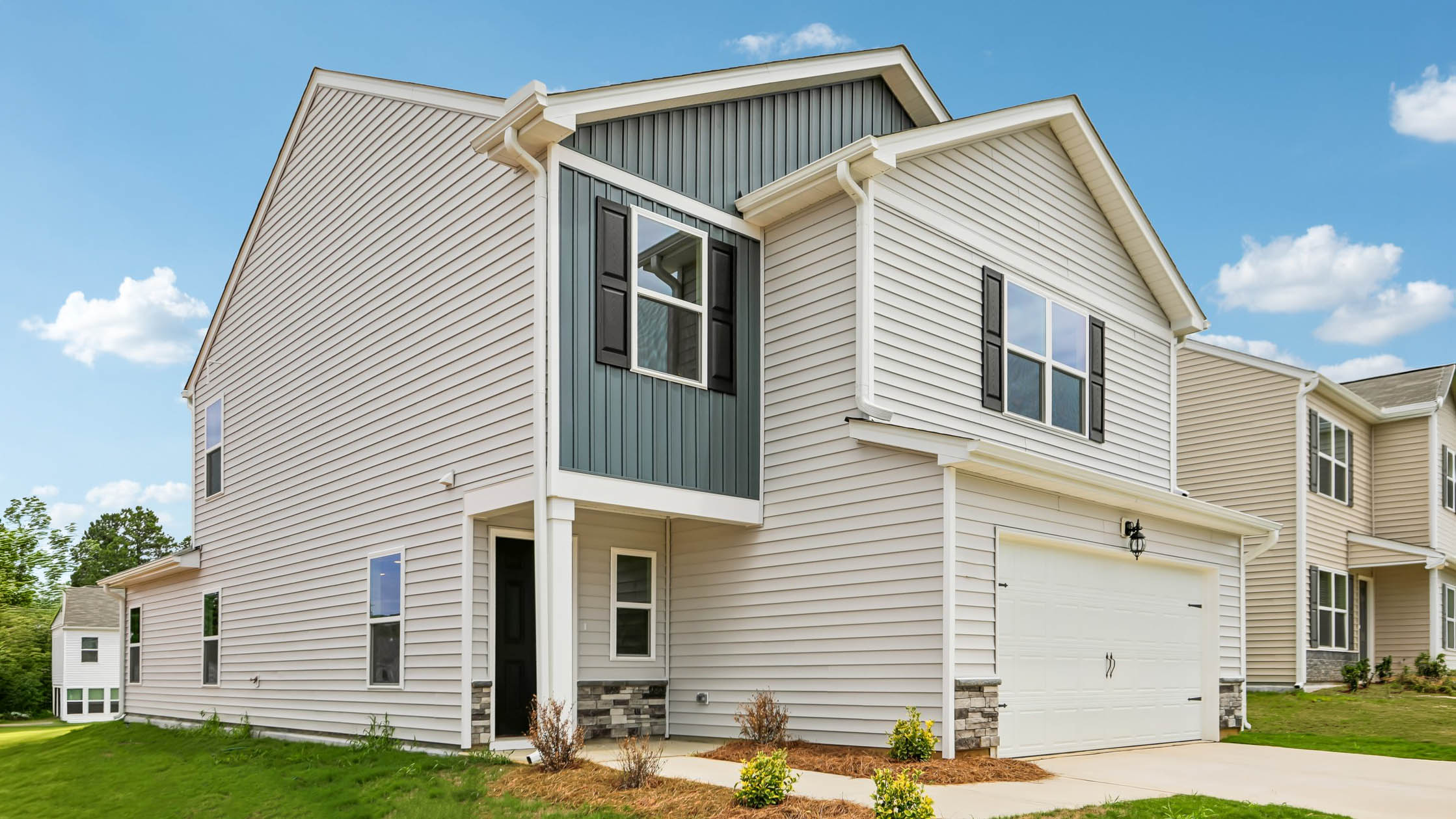 front exterior with 2 car garage