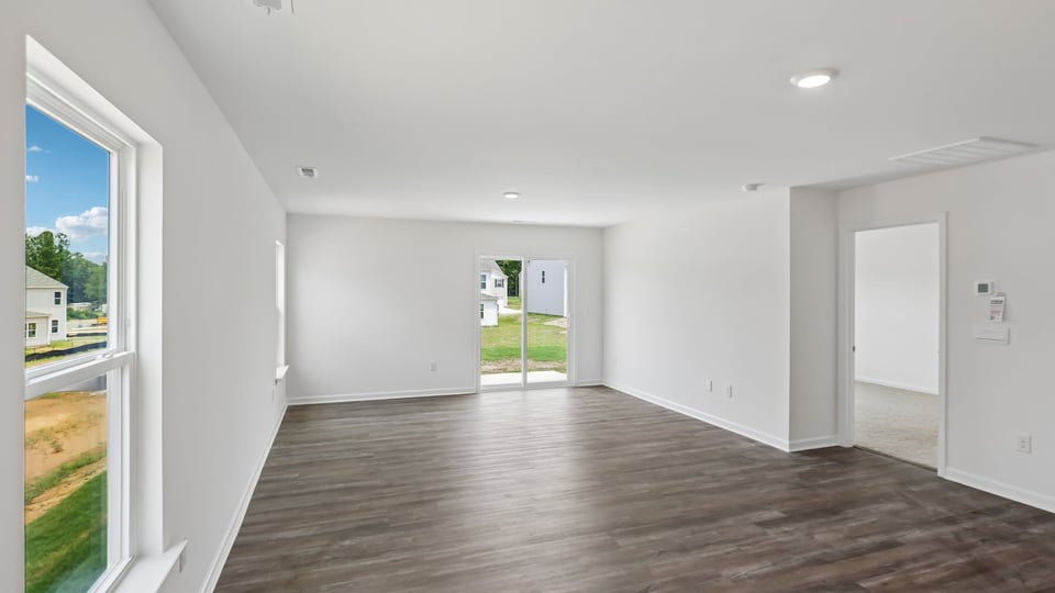 open concept living space with large windows