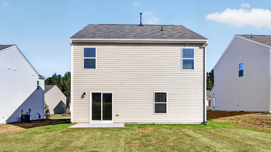 exterior patio with concrete slab and open yard