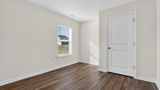 additional bedroom with window, carpeting, closet